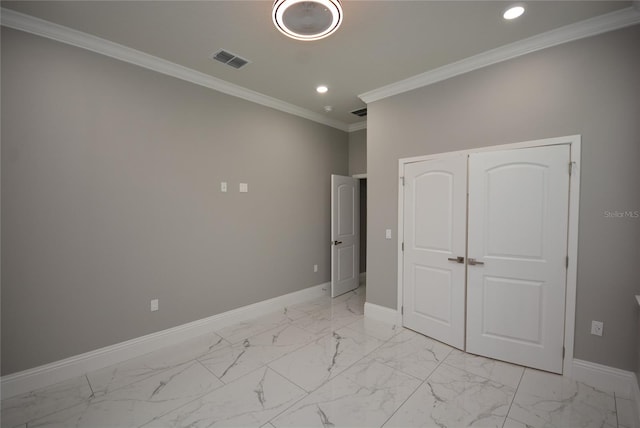 unfurnished bedroom featuring a closet and ornamental molding