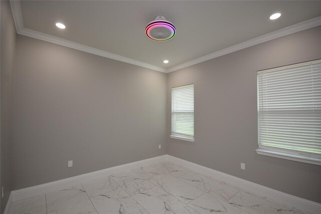 unfurnished room featuring ornamental molding