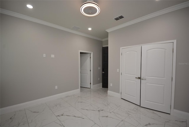 unfurnished bedroom with a closet and ornamental molding