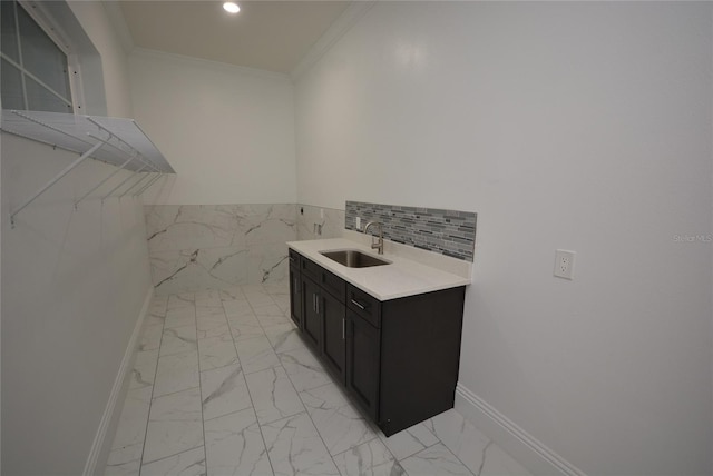 interior space with vanity and crown molding