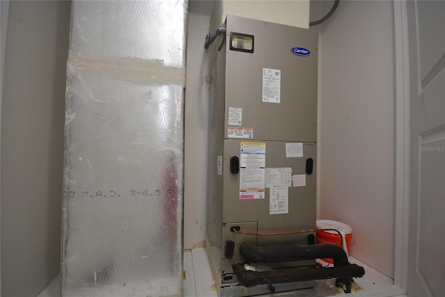 utility room with heating unit