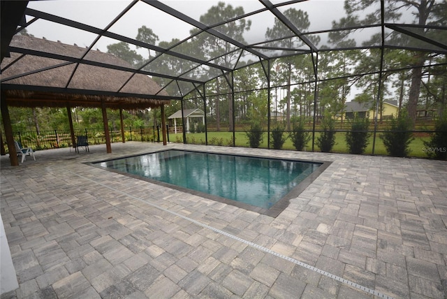 view of pool featuring a patio and a lanai