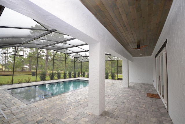 view of pool with a lanai and a patio area