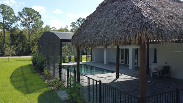 view of swimming pool with a yard and a patio area