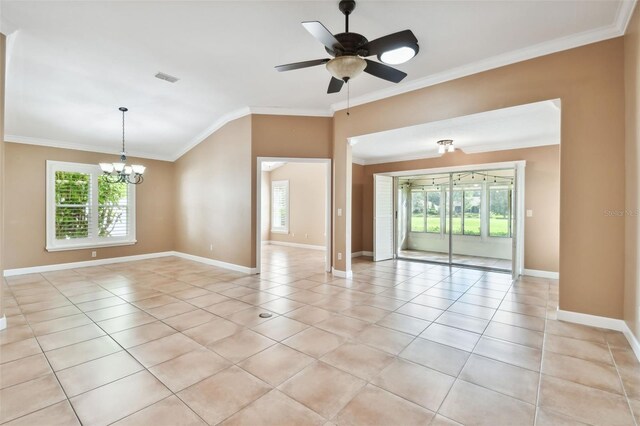 tiled empty room with ceiling fan with notable chandelier, crown molding, and a wealth of natural light