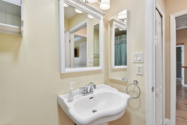 bathroom featuring tile patterned flooring and sink