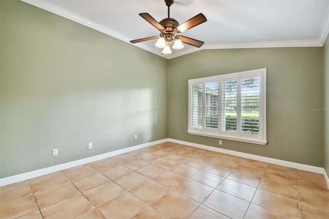 spare room featuring ceiling fan, lofted ceiling, crown molding, and light tile patterned floors