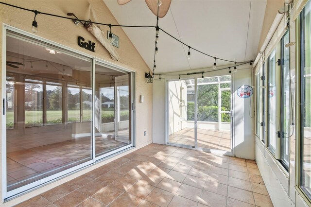 unfurnished sunroom with vaulted ceiling