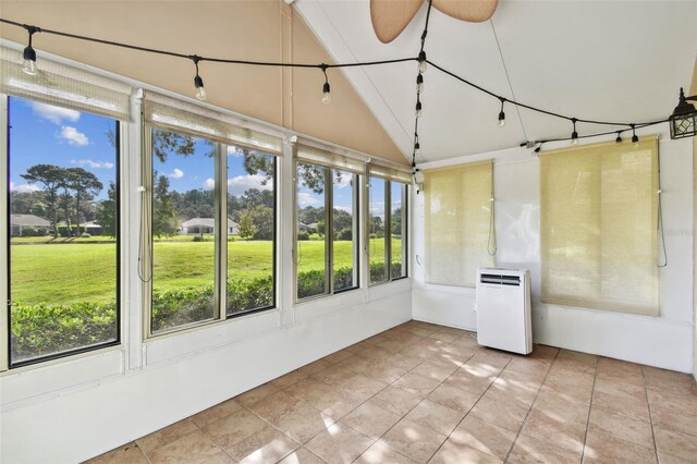 unfurnished sunroom featuring lofted ceiling