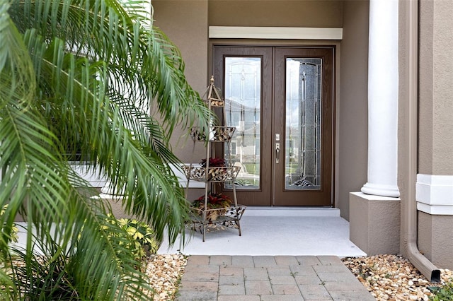 view of exterior entry featuring french doors