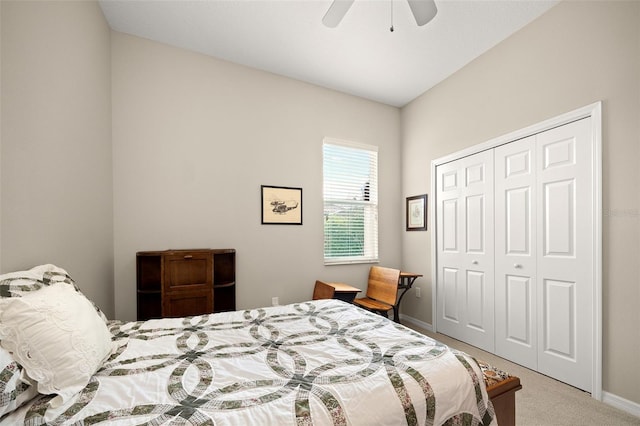 carpeted bedroom with ceiling fan and a closet