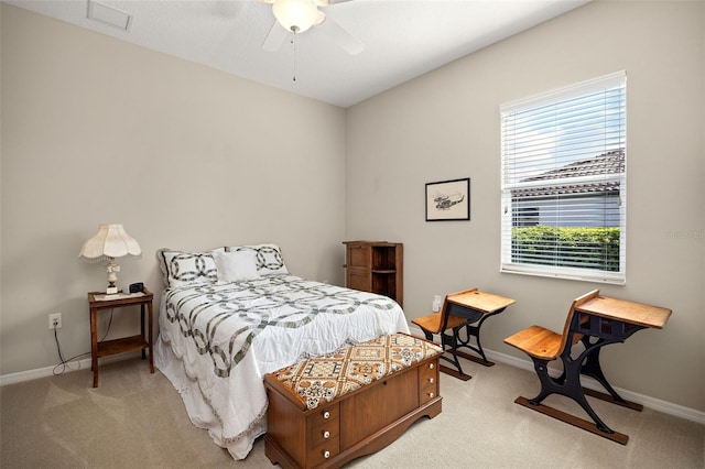 bedroom featuring light carpet and ceiling fan