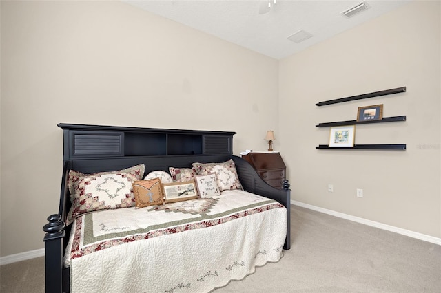 bedroom with ceiling fan and carpet floors