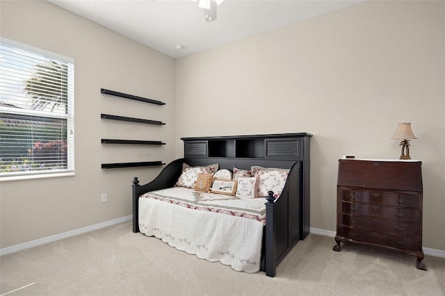 carpeted bedroom featuring ceiling fan