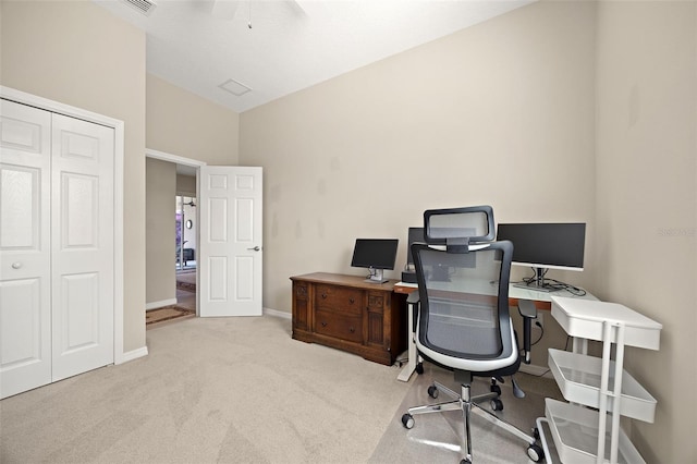 office space featuring ceiling fan and light colored carpet