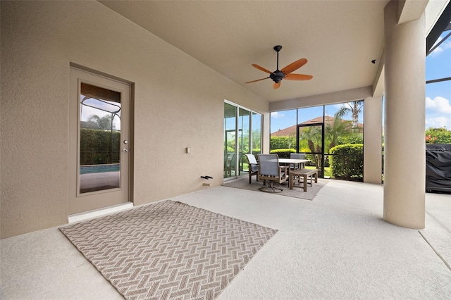 sunroom / solarium with ceiling fan