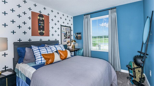 195 River Front Way, Edgewater, FL 32141 - carpeted bedroom featuring baseboards and wallpapered walls