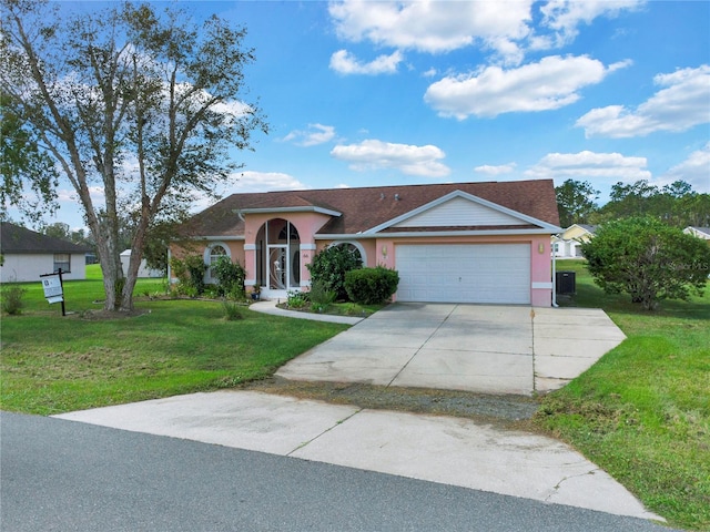 single story home with a front lawn and a garage