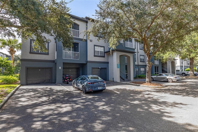 townhome / multi-family property featuring a garage