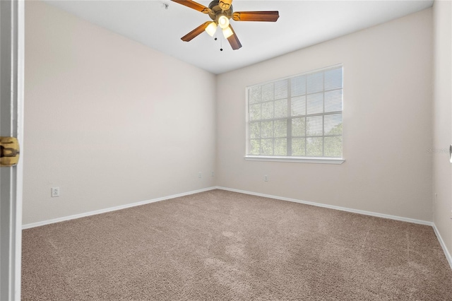 carpeted empty room with ceiling fan