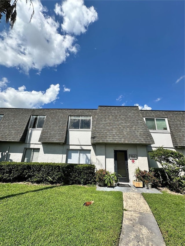 1944 Conway Rd Unit 6, Orlando, FL 32812 - multi unit property featuring stucco siding, a shingled roof, a front lawn, and mansard roof