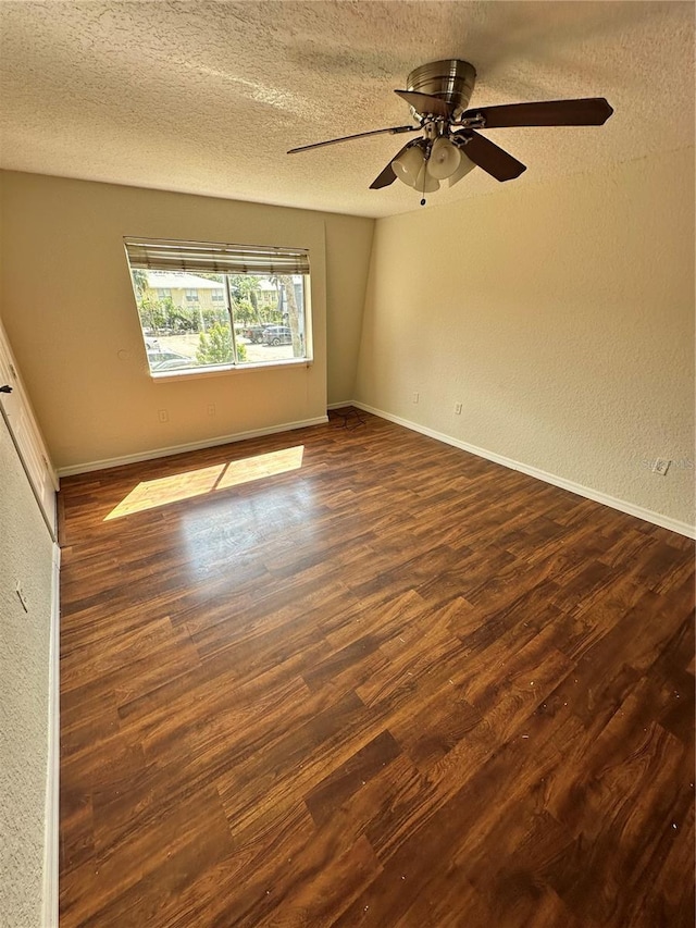 1944 Conway Rd Unit 6, Orlando, FL 32812 - empty room featuring dark wood-style flooring, a textured ceiling, a ceiling fan, baseboards, and a textured wall