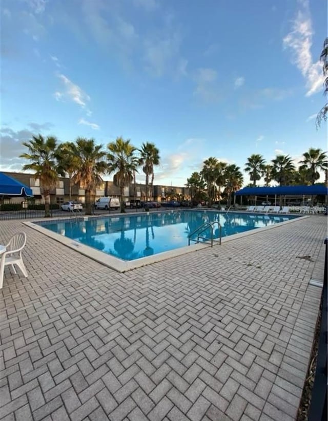 view of swimming pool with a patio area