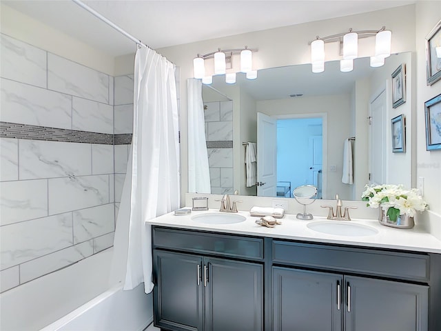 bathroom featuring vanity and shower / bath combo