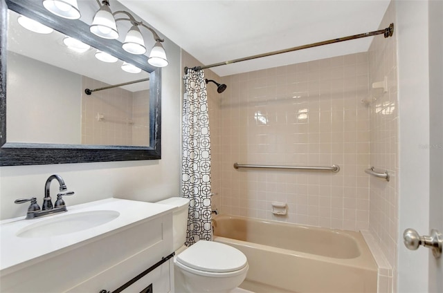 full bathroom with vanity, shower / tub combo, and toilet