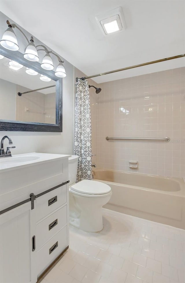 full bathroom with tile patterned floors, shower / bath combo, vanity, and toilet