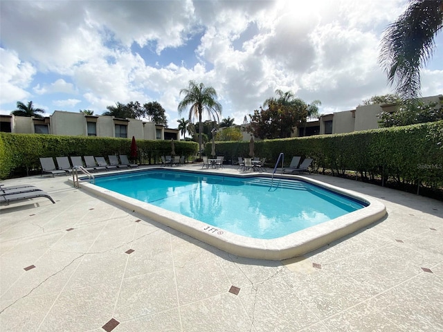 view of swimming pool featuring a patio