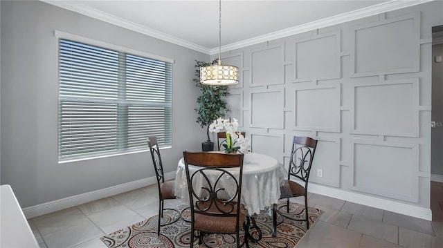 dining room featuring ornamental molding and tile patterned flooring