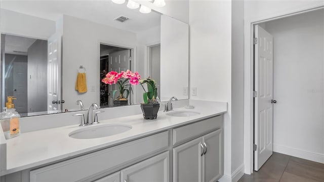 bathroom with vanity and tile patterned flooring