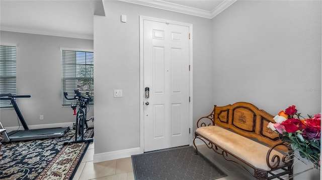 tiled entryway featuring ornamental molding