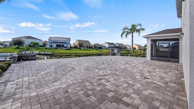 view of patio with a water view