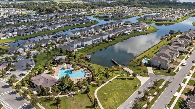 birds eye view of property with a water view