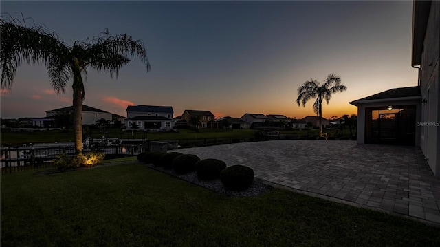 yard at dusk with a patio