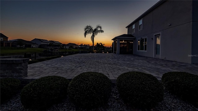 yard at dusk with a patio