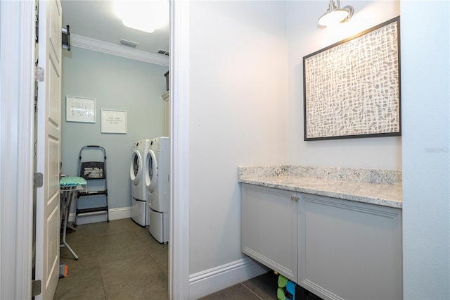 washroom featuring washer and clothes dryer, tile patterned flooring, and crown molding