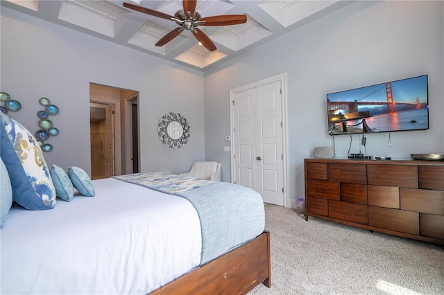 bedroom featuring beam ceiling, ceiling fan, light colored carpet, and coffered ceiling