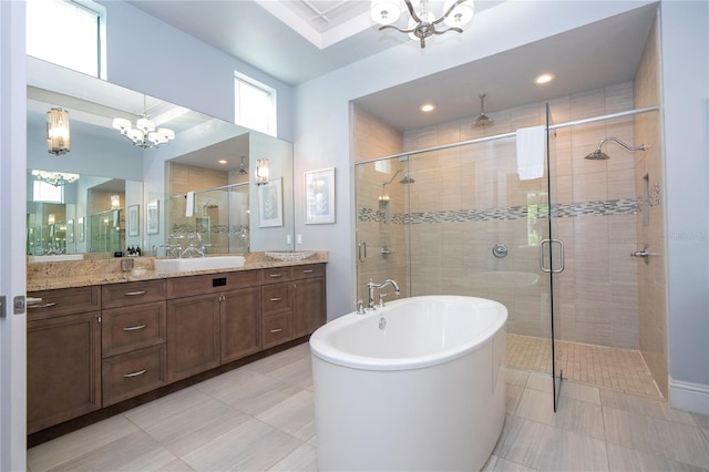 bathroom featuring independent shower and bath, vanity, a chandelier, and tile patterned flooring