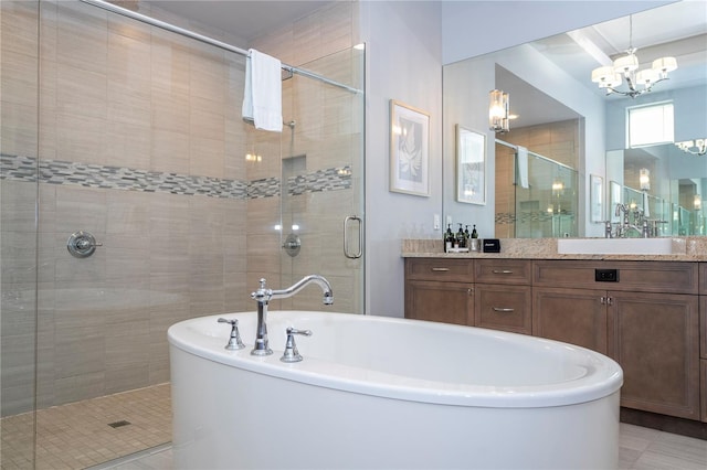 bathroom featuring vanity, shower with separate bathtub, an inviting chandelier, and tile patterned floors