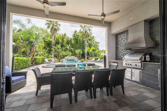 view of patio / terrace with area for grilling, ceiling fan, a swimming pool with hot tub, and grilling area