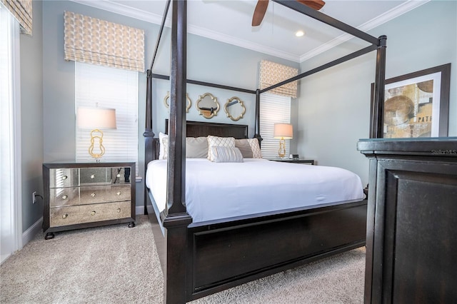 bedroom with carpet, ornamental molding, and ceiling fan