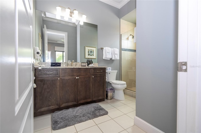 bathroom featuring vanity, tile patterned flooring, ornamental molding, toilet, and an enclosed shower