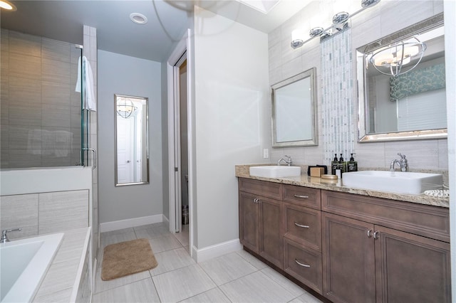 bathroom with vanity, tile patterned flooring, and separate shower and tub