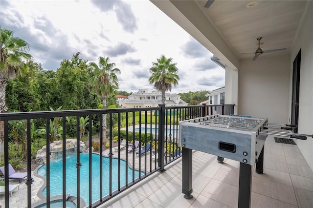 balcony featuring ceiling fan and a patio area