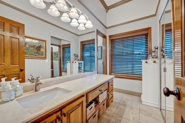 bathroom featuring tile patterned floors, vanity, and crown molding