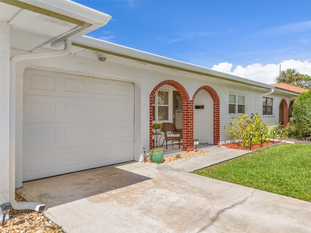 view of front facade with a front lawn and a garage