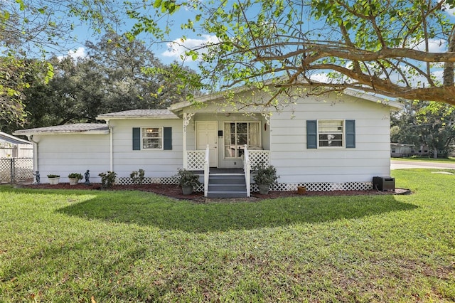 ranch-style home with a front lawn